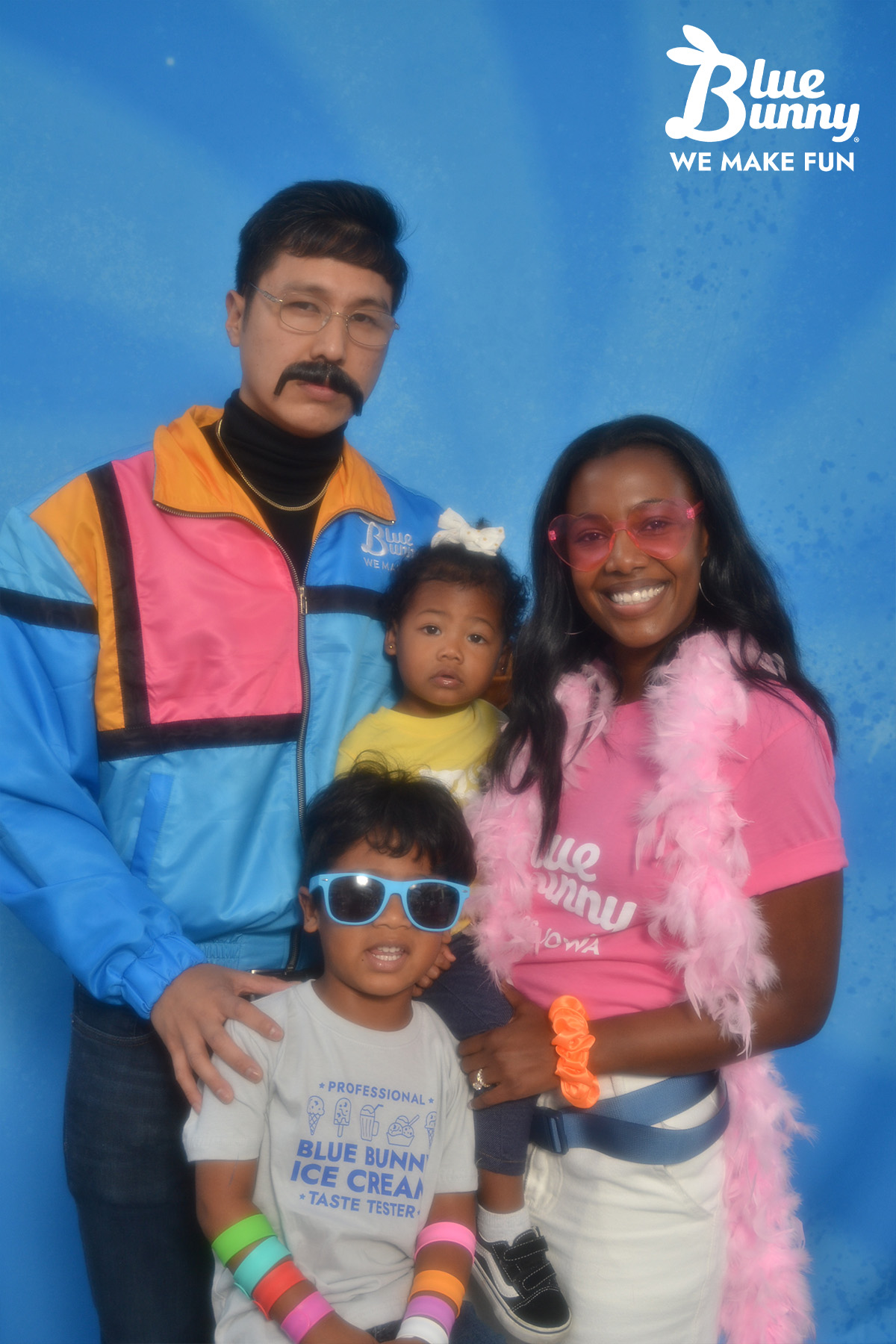 Family of four wearing fun 90s gear