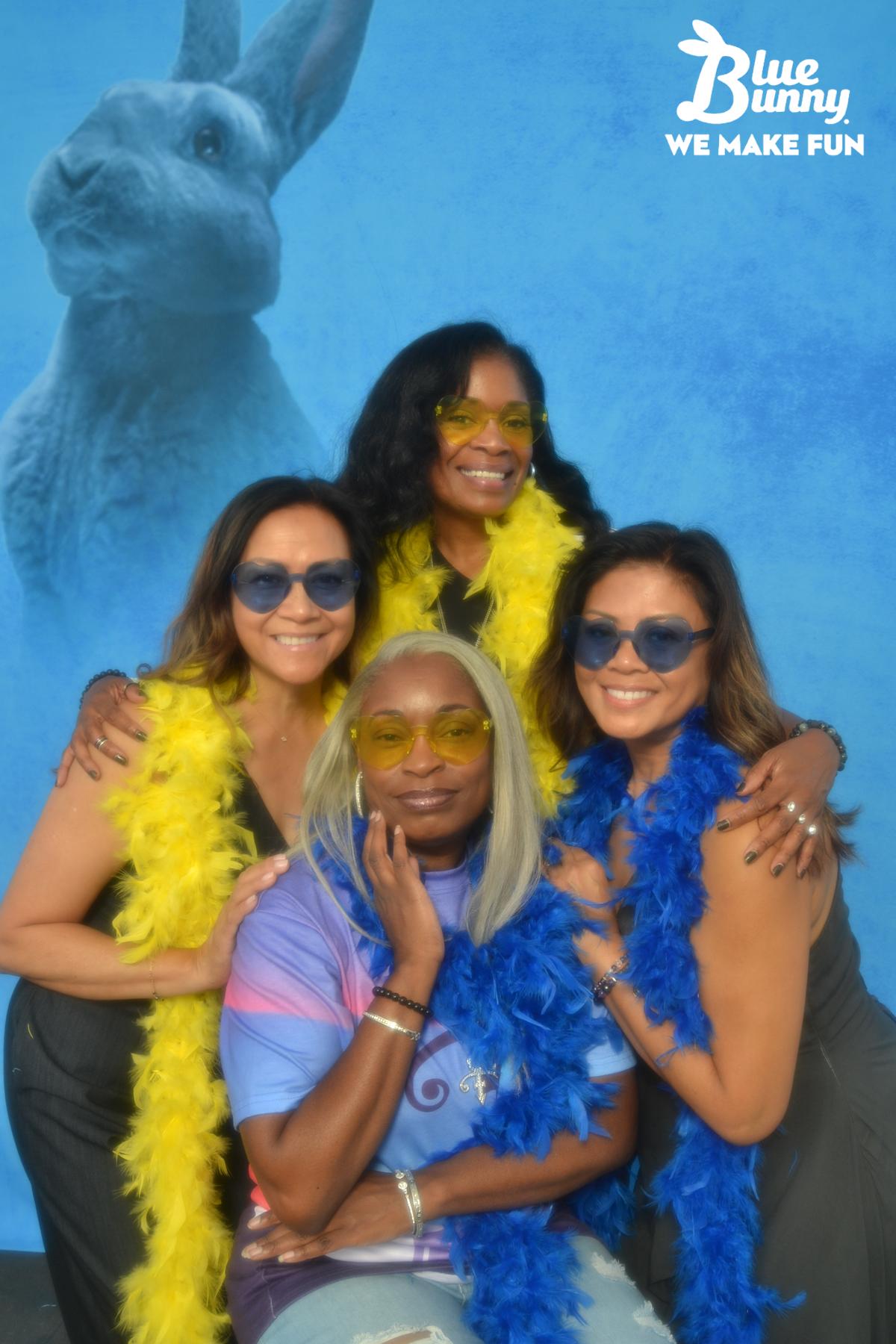 Four women in boas and sunglasses