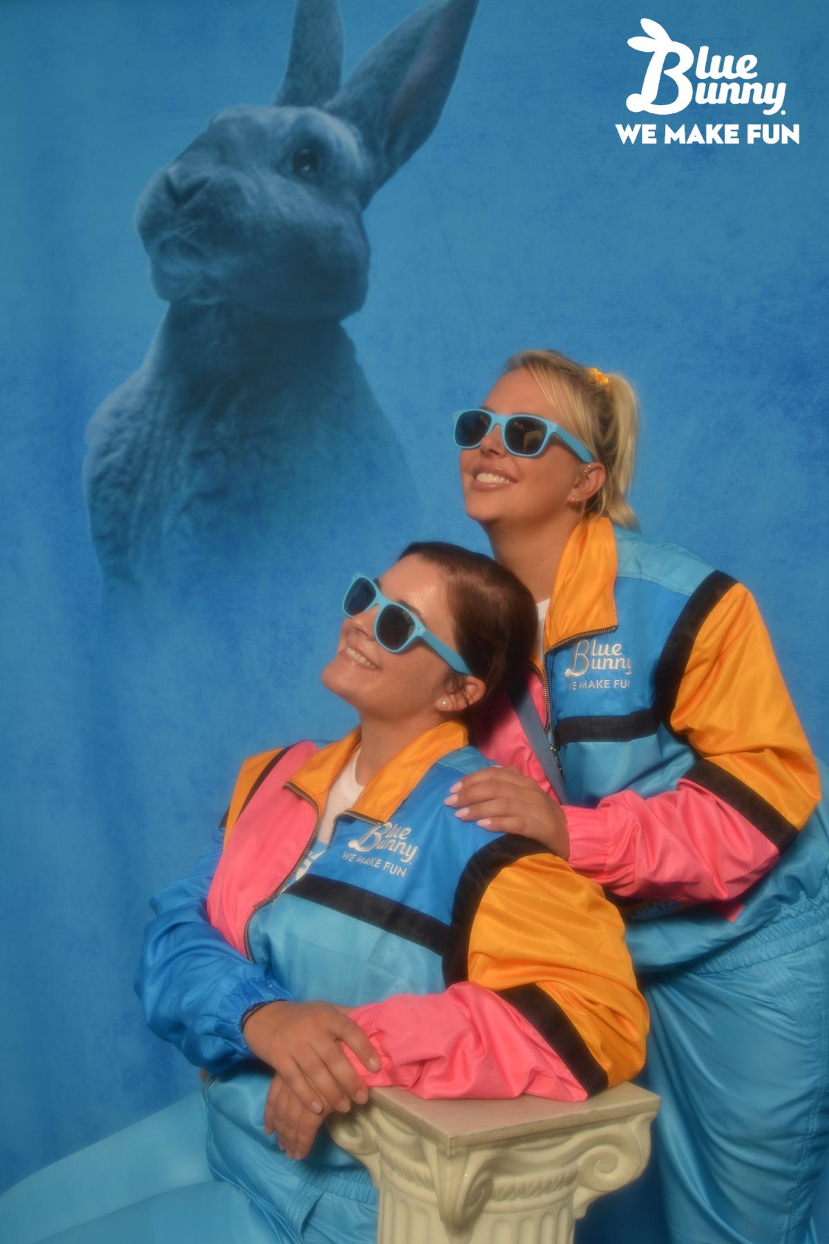 Two woman in sweatsuits looking off into the distance